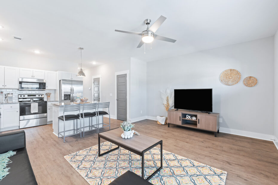 Modern furnished living room with large windows at The Haven at Wake