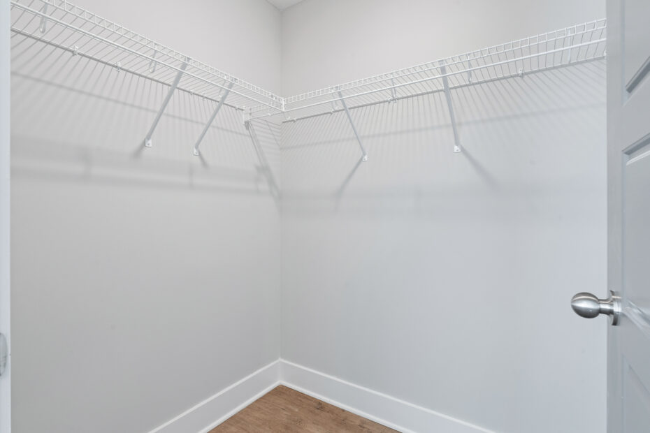 Spacious bedroom with queen-size bed and walk-in closet at The Haven at Wake