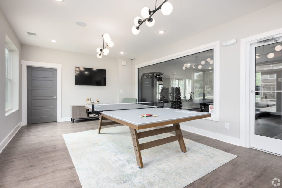 Two-story clubhouse at The Haven at Wake with lounge area, coffee bar & ping pong area.