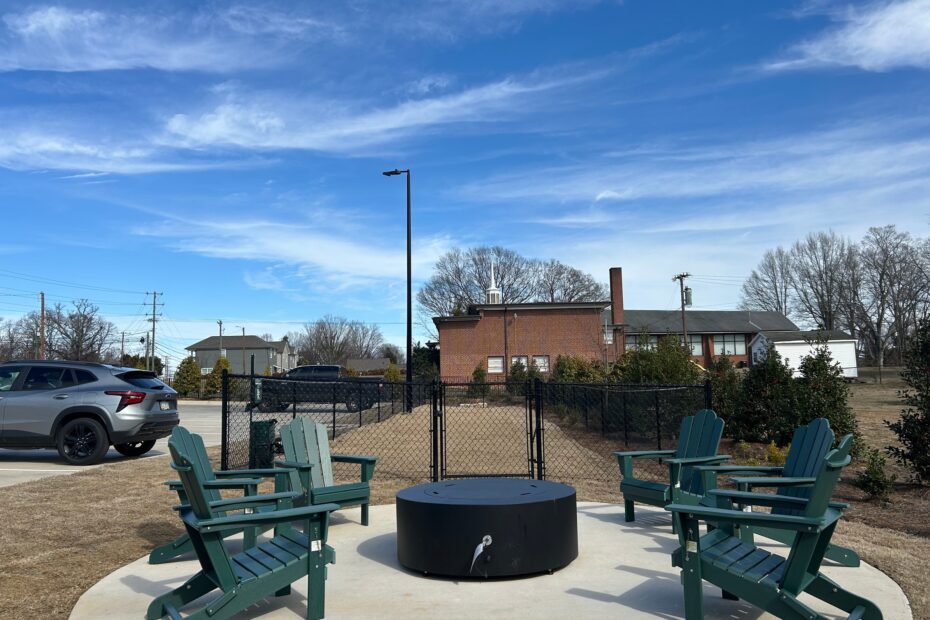 Cozy fire pit and grill station adjacent to the pool and clubhouse at The Haven at Wake.